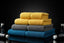 Stack of premium microfiber detailing towels in various colors